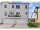 Modern townhouses featuring two-car garages and balconies at 4190 Douro Trl, Westfield, IN 46062