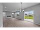 Bright dining room with hardwood floors and sliding glass doors to backyard at 10207 Carya Ct, Indianapolis, IN 46259