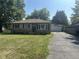 Ranch house with attached garage and lawn at 3509 Campbell St, Plainfield, IN 46168