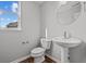 Small powder room with pedestal sink and toilet at 4330 Ironclad Dr, Bargersville, IN 46106