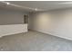 Loft bedroom with grey carpeting and an additional room at 4982 Reavie Ct, Noblesville, IN 46062