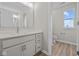 Modern bathroom with vanity, toilet, and window at 4988 Amber Crest Dr, Brownsburg, IN 46112