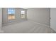 Bright bedroom with two windows and neutral gray carpet at 4988 Amber Crest Dr, Brownsburg, IN 46112