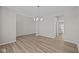 Bright dining room features hardwood floors and a modern light fixture at 4988 Amber Crest Dr, Brownsburg, IN 46112