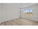 Spacious dining area with large window and hardwood floors at 4988 Amber Crest Dr, Brownsburg, IN 46112