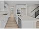 Modern kitchen with white cabinets, granite countertops, and stainless steel appliances at 4988 Amber Crest Dr, Brownsburg, IN 46112