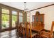 Formal dining room with hardwood floors and a large wood table at 12980 W Mt. Healthy Rd, Columbus, IN 47201