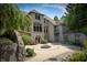 Stone house exterior with a large patio and fire pit at 12980 W Mt. Healthy Rd, Columbus, IN 47201