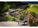 Relaxing pool area with a waterfall and lounge chairs at 12980 W Mt. Healthy Rd, Columbus, IN 47201