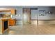 Basement bar with wood cabinets, metal accents, and a rustic barn door at 12980 W Mt. Healthy Rd, Columbus, IN 47201