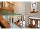 Two-story entryway with hardwood floors and wood staircase at 12980 W Mt. Healthy Rd, Columbus, IN 47201