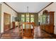 Spacious dining room with hardwood floors and large windows at 12980 W Mt. Healthy Rd, Columbus, IN 47201
