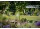 Relaxing pergola with hanging chairs and lush greenery at 12980 W Mt. Healthy Rd, Columbus, IN 47201