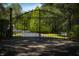 Ornate black metal gate leading to a home at 12980 W Mt. Healthy Rd, Columbus, IN 47201