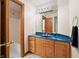 Bathroom with blue granite vanity, large mirror, and shower at 12980 W Mt. Healthy Rd, Columbus, IN 47201