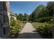 Stone pathway leading through a landscaped yard at 12980 W Mt. Healthy Rd, Columbus, IN 47201