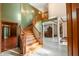 Elegant curved staircase with wood railing, connecting the home's levels at 12980 W Mt. Healthy Rd, Columbus, IN 47201