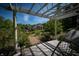 Pergola view overlooking house, pool, and manicured lawn at 12980 W Mt. Healthy Rd, Columbus, IN 47201