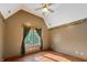 Bedroom with hardwood floors and a window overlooking the woods at 12980 W Mt. Healthy Rd, Columbus, IN 47201