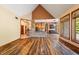 Open living area with hardwood floors and large windows at 12980 W Mt. Healthy Rd, Columbus, IN 47201