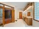 Large bathroom with double vanity, glass block windows, and a shower at 12980 W Mt. Healthy Rd, Columbus, IN 47201