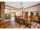 Spacious dining area featuring a large table and hardwood floors at 12980 W Mt. Healthy Rd, Columbus, IN 47201