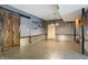 Unfinished basement area with rustic barn door at 12980 W Mt. Healthy Rd, Columbus, IN 47201