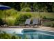 Relaxing poolside lounge chairs near the pool at 12980 W Mt. Healthy Rd, Columbus, IN 47201