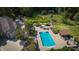 Aerial view of house, pool, and landscaped yard at 12980 W Mt. Healthy Rd, Columbus, IN 47201