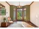 Sunlit living area featuring bay windows and hardwood floors at 12980 W Mt. Healthy Rd, Columbus, IN 47201
