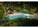 Inviting in-ground pool with a wooden pergola at 12980 W Mt. Healthy Rd, Columbus, IN 47201