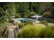 Inviting pool area with lounge chairs and stonework at 12980 W Mt. Healthy Rd, Columbus, IN 47201