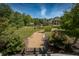 Stone path meanders through lush landscaping toward house at 12980 W Mt. Healthy Rd, Columbus, IN 47201