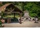 Stone outdoor fireplace and seating area at 12980 W Mt. Healthy Rd, Columbus, IN 47201