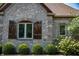 Stone and brick house exterior with shutters at 12980 W Mt. Healthy Rd, Columbus, IN 47201