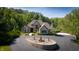 Stone house with circular driveway and fountain at 12980 W Mt. Healthy Rd, Columbus, IN 47201