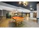 Basement with pool table, bar and fireplace at 12980 W Mt. Healthy Rd, Columbus, IN 47201