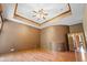 Bright bedroom with hardwood floors and a tray ceiling at 12980 W Mt. Healthy Rd, Columbus, IN 47201