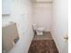 Small toilet and sink area with laminate flooring at 40 Bixler Rd, Indianapolis, IN 46227