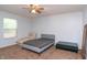 Spacious bedroom with carpeted floor, large window, and ceiling fan at 40 Bixler Rd, Indianapolis, IN 46227