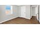 Spacious bedroom featuring wood-look floors and ample closet space at 215 N Randolph St, Indianapolis, IN 46201