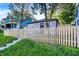 Cute purple house with picket fence and landscaping at 215 N Randolph St, Indianapolis, IN 46201