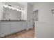 Double vanity bathroom with gray countertop and a walk-in shower at 3472 Hauser Ct, Bargersville, IN 46106