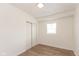 Bright bedroom with wood-look floors and a double door closet at 728 E Beecher St, Indianapolis, IN 46203