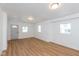 Spacious living room with light wood-look floors at 728 E Beecher St, Indianapolis, IN 46203