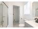 Updated bathroom with a walk-in shower and gray vanity at 728 E Beecher St, Indianapolis, IN 46203