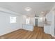 Open concept kitchen features white shaker cabinets and an island at 728 E Beecher St, Indianapolis, IN 46203