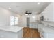 Modern kitchen with white cabinets, stainless steel appliances, and light countertops at 728 E Beecher St, Indianapolis, IN 46203
