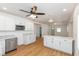 Spacious kitchen with white cabinets, center island, and hardwood floors at 728 E Beecher St, Indianapolis, IN 46203