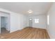 Bright and airy living room with light wood-look floors at 728 E Beecher St, Indianapolis, IN 46203